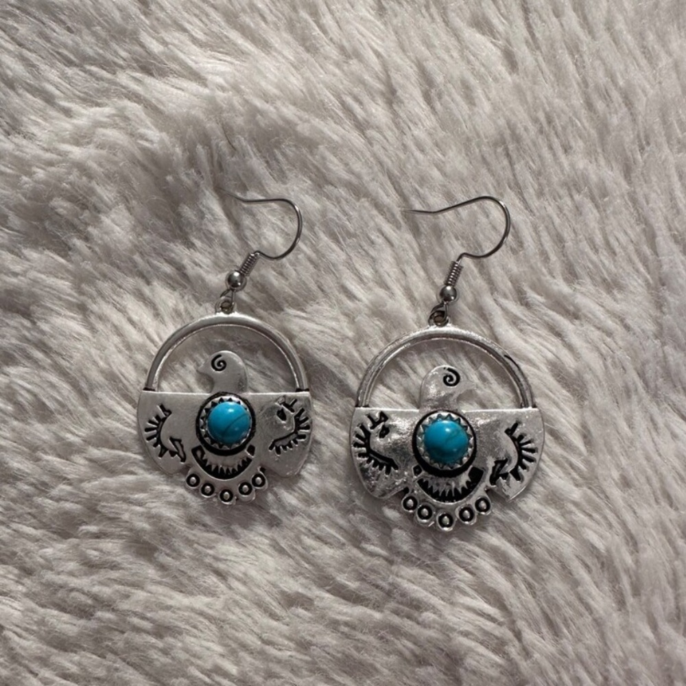 Turquoise and silver thunderbird earrings